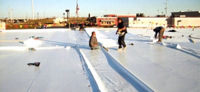 Canyon Roofing applying duro-last roofing.