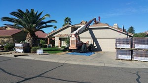 peoria roofers working on roof with machinery