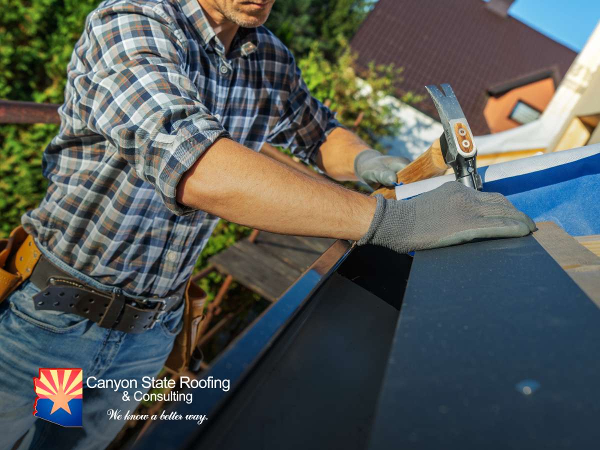 A Roofing Contractor installing new materials on a roof in Arizona.