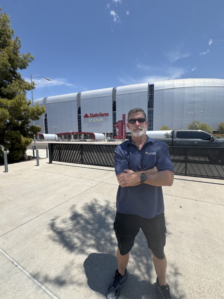 Jim McLain of Canyon State Roofing at the Glendale, Arizona city sign
